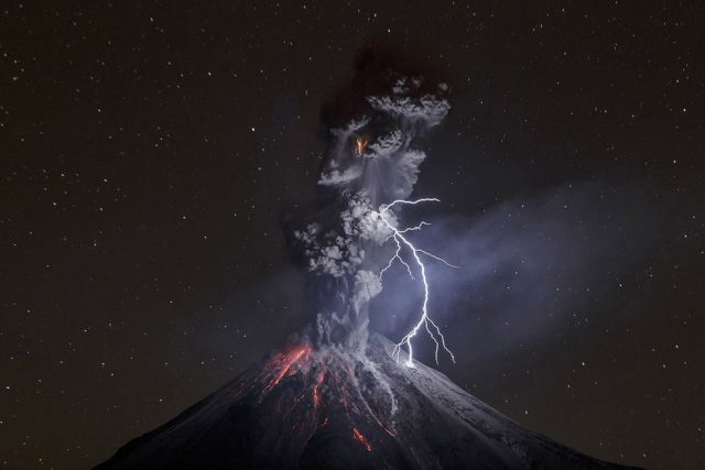 Colima Volcano erupting at night