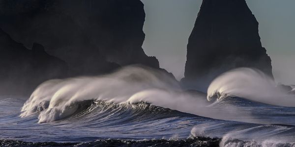 Waves in front of rock formation